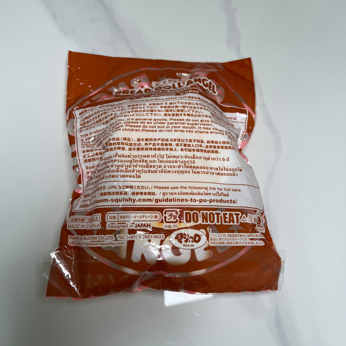 Back of iBLOOM Bread Doll Angel squishy original packaging with product information