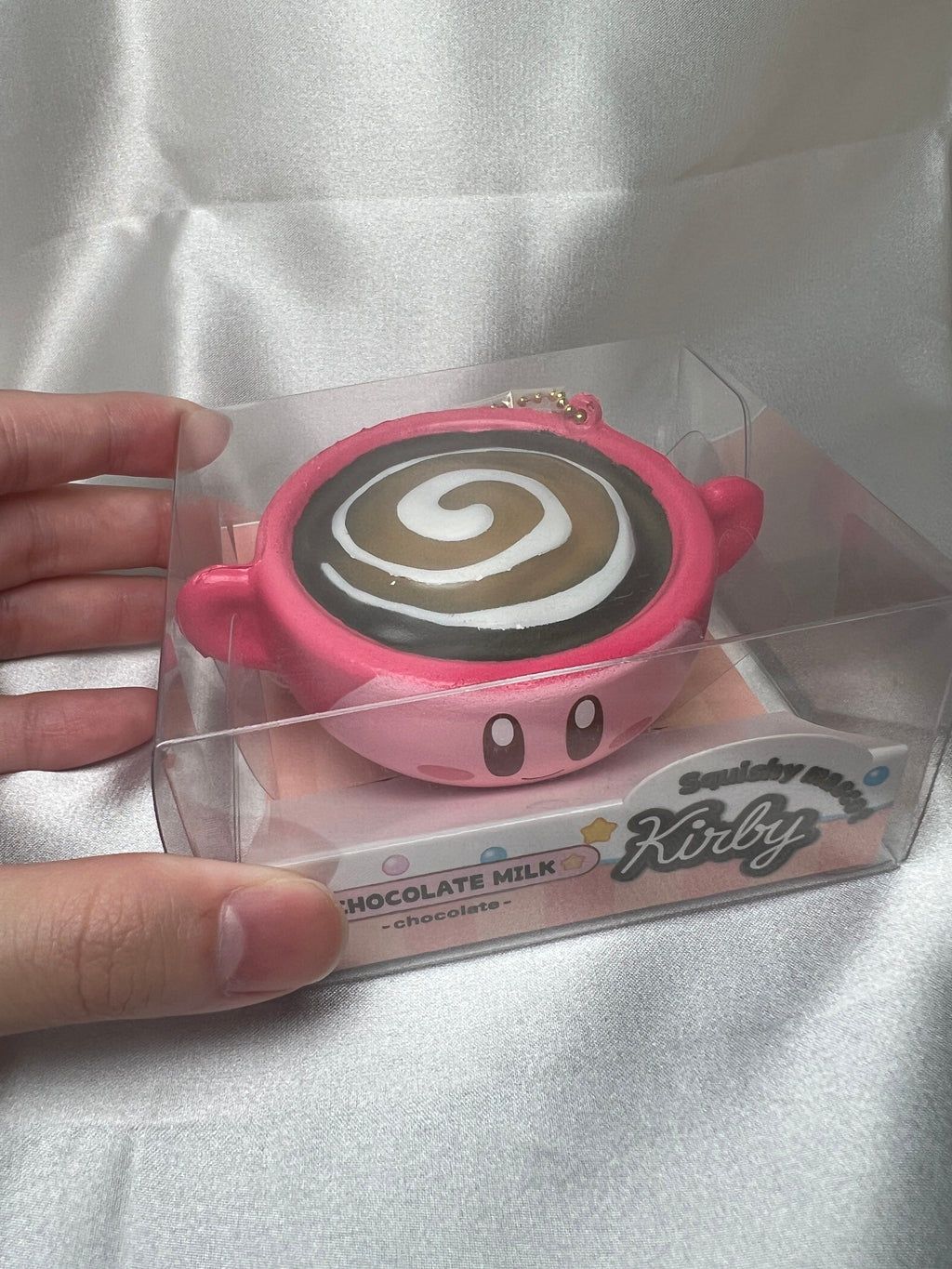 Kirby Chocolate Milk Squishy Mascot top and front view in clear display box