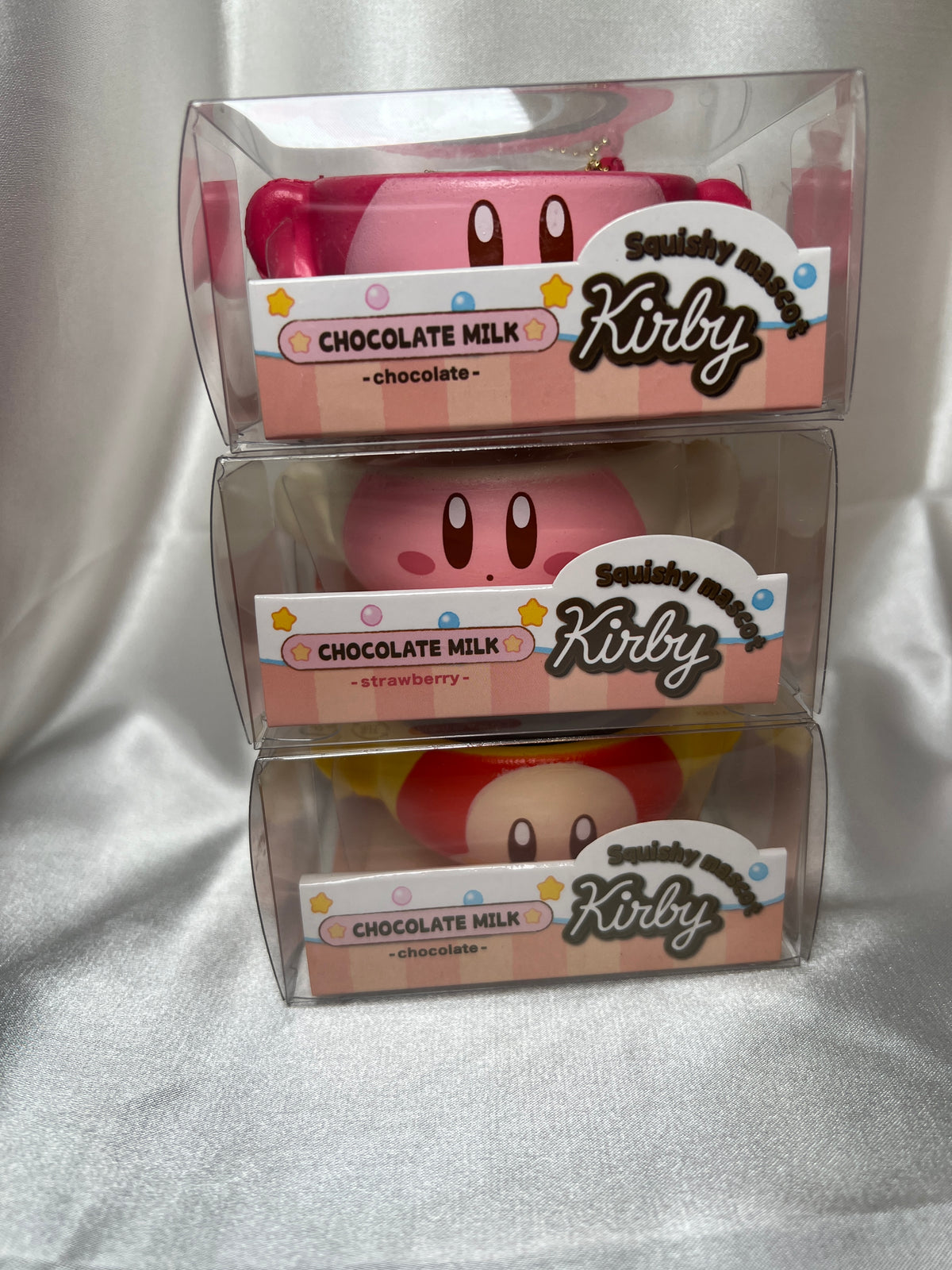 Kirby Chocolate Milk Squishy Mascots stacked in clear boxes with Strawberry Milk Kirby, Chocolate Milk Kirby and Waddle Dee