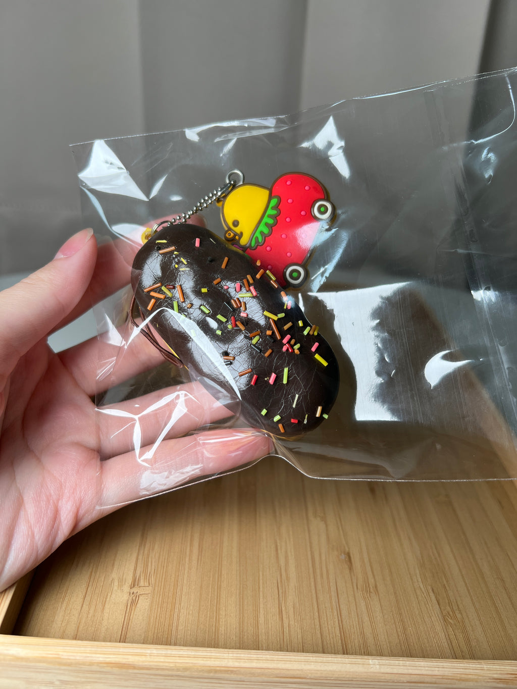 Rare San-X Kiiroitori chocolate eclair squishy with strawberry car charm close-up