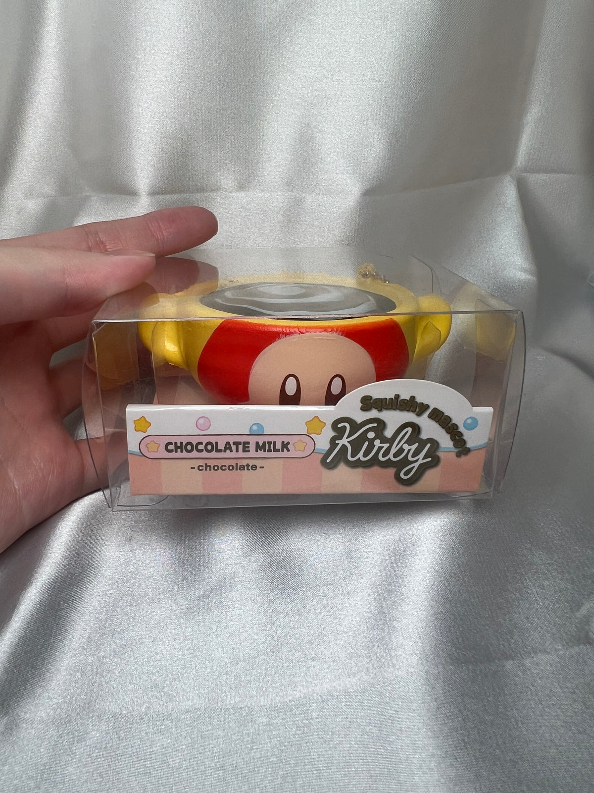 Waddle Dee Chocolate Milk Squishy Mascot front view in original clear packaging